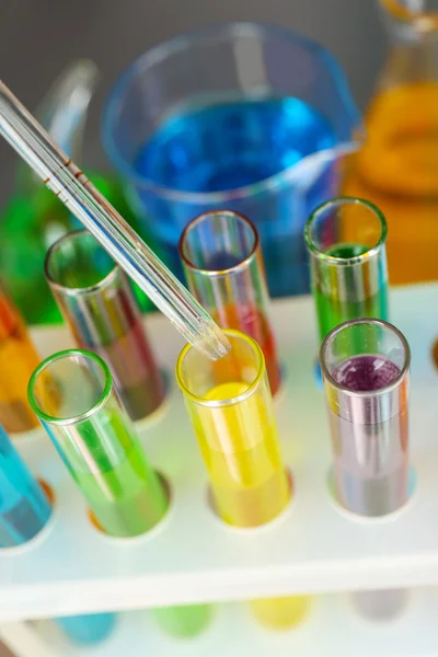 Laboratory glassware with colorful liquid — Stock Photo, Image