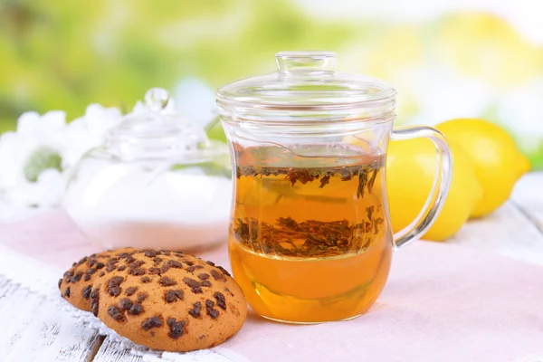 Cup of tea on table on bright background — Stock Photo, Image