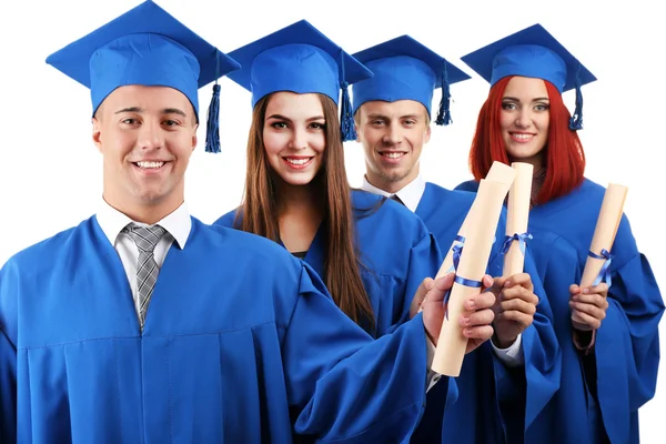 Estudantes de graduação vestindo chapéu e vestido de formatura, isolados em branco — Fotografia de Stock