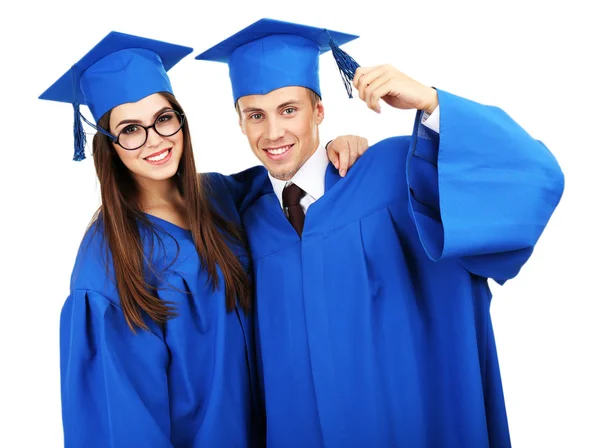 Estudantes de graduação vestindo chapéu e vestido de formatura, isolados em branco — Fotografia de Stock