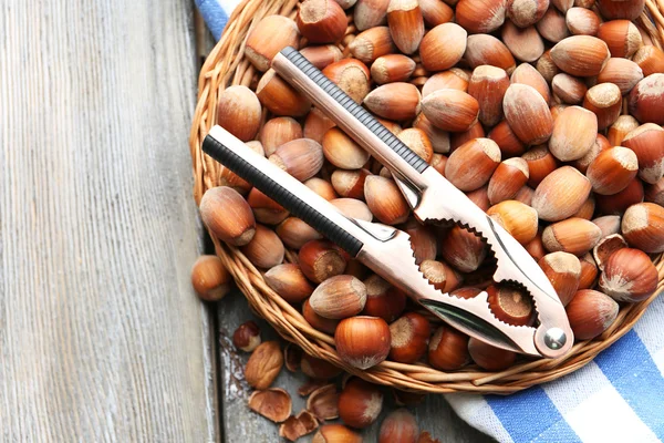 Hazelnuts in wicker basket — Stock Photo, Image