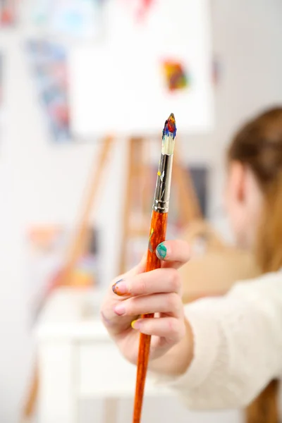 Artist holding paintbrush — Stock Photo, Image
