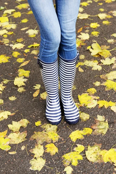 Girl in rubber boots — Stock Photo, Image