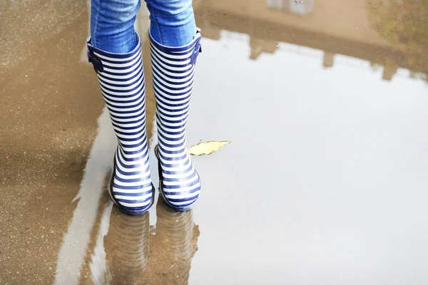 Girl in rubber boots — Stock Photo, Image