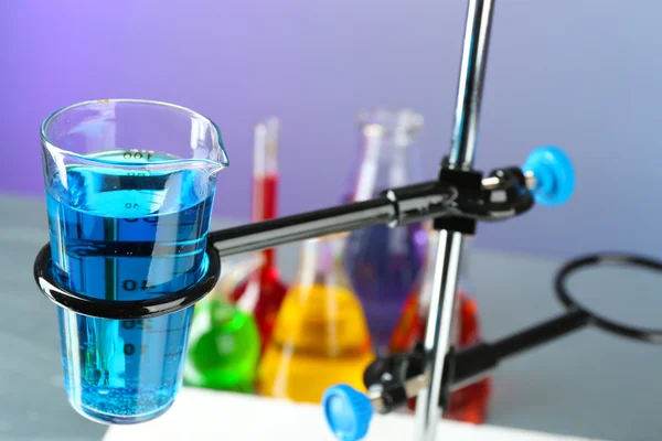 Laboratory glassware with colorful liquid — Stock Photo, Image