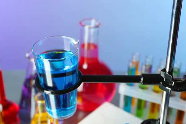 Laboratory glassware with colorful liquid — Stock Photo, Image