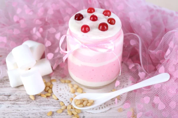 Raspberry milk dessert in glass jar — Stock Photo, Image