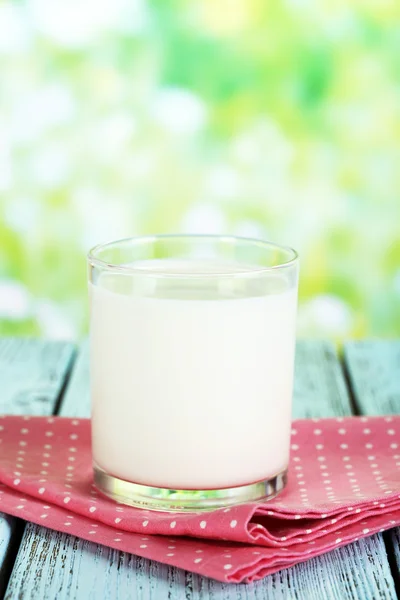 Milk in glass on napkin — Stock Photo, Image