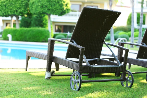 Lounge sunbeds near pool — Stock Photo, Image