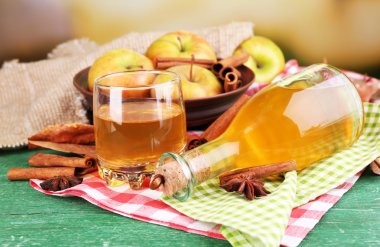 Composition of apple cider with cinnamon sticks clipart