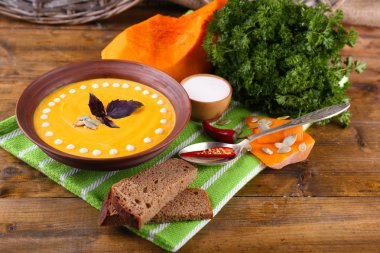Pumpkin soup in plate clipart