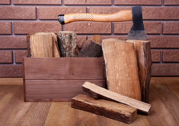 Box of firewood and axe — Stock Photo, Image