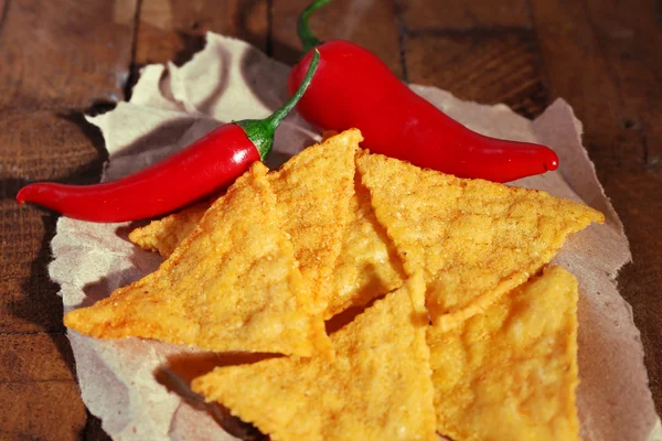 Tasty nachos and chili pepper — Stock Photo, Image