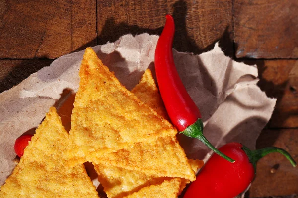 Tasty nachos and chili pepper — Stock Photo, Image