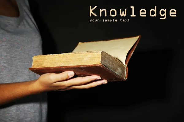 Woman holding very old book with dust — Stock Photo, Image