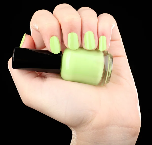 Nail polish in hand, close-up — Stock Photo, Image