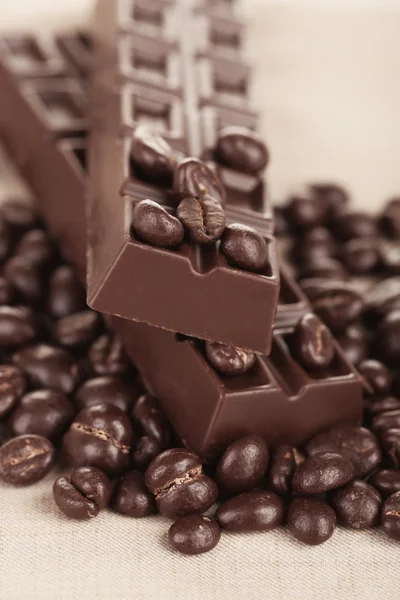 Coffee beans and dark chocolate — Stock Photo, Image