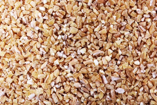 Wheat groats background — Stock Photo, Image