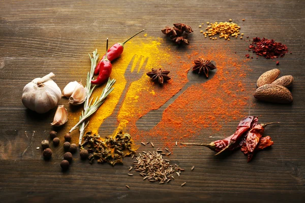 Specerijen op tafel met bestek silhouet — Stockfoto