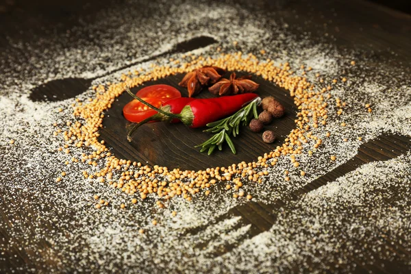 Especiarias na mesa com silhueta de talheres — Fotografia de Stock