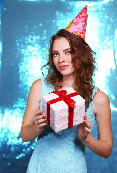 Portrait of beautiful young girl on bright blue background — Stok Foto