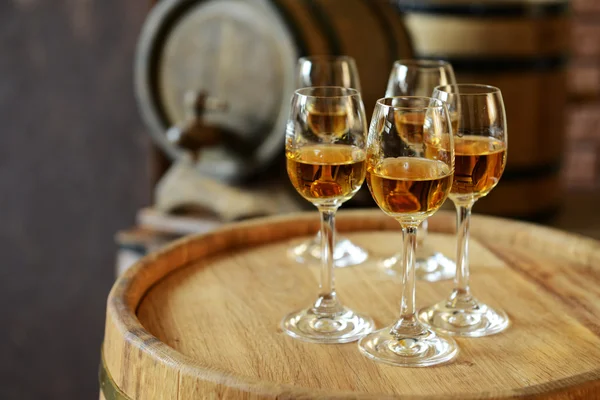 Glasses of wine in cellar — Stock Photo, Image