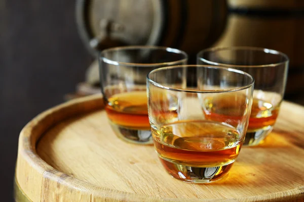 Glasses of brandy in cellar — Stock Photo, Image