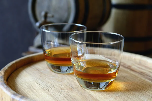 Glasses of brandy in cellar — Stock Photo, Image