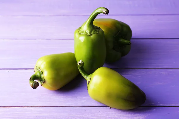 Green pepper on wooden background — Stock Photo, Image