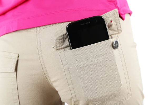 Смартфон в джинсах крупным планом — стоковое фото