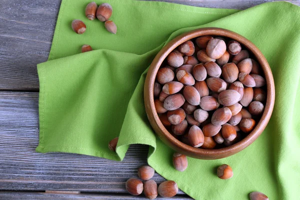 Hazelnuts in wooden bowl — Stock Photo, Image