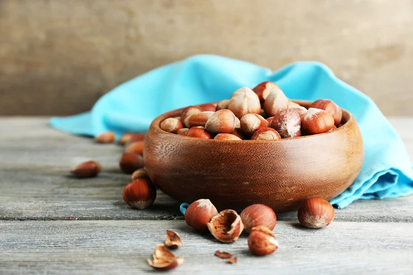 Hazelnuts in wooden bowl — Stock Photo, Image