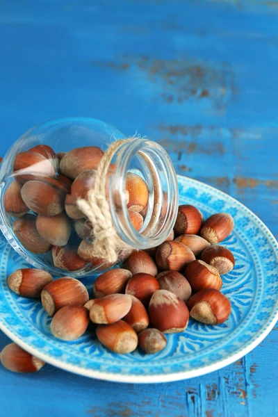 Hazelnuts in plate on table — Stock Photo, Image