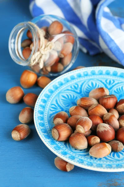 Hazelnuts in plate on table — Stock Photo, Image