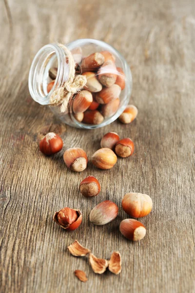 Hazelnuts in glass jar — Stock Photo, Image