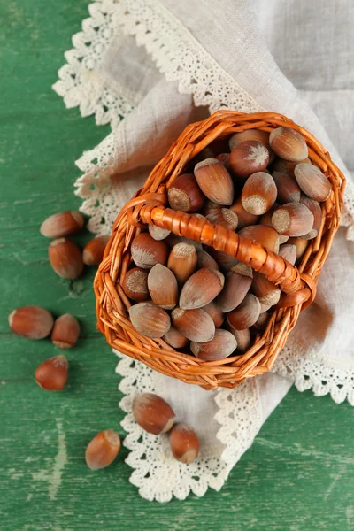 Hazelnuts in wicker basket — Stock Photo, Image