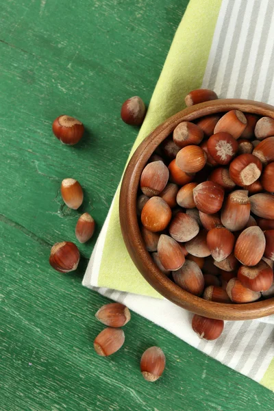 Hazelnuts in wooden bowl — Stock Photo, Image