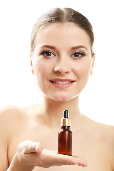 Mulher jovem bonita com óleo de aroma isolado em branco — Fotografia de Stock