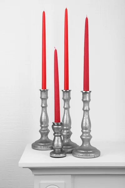 Candles in candle holders on table — Stock Photo, Image