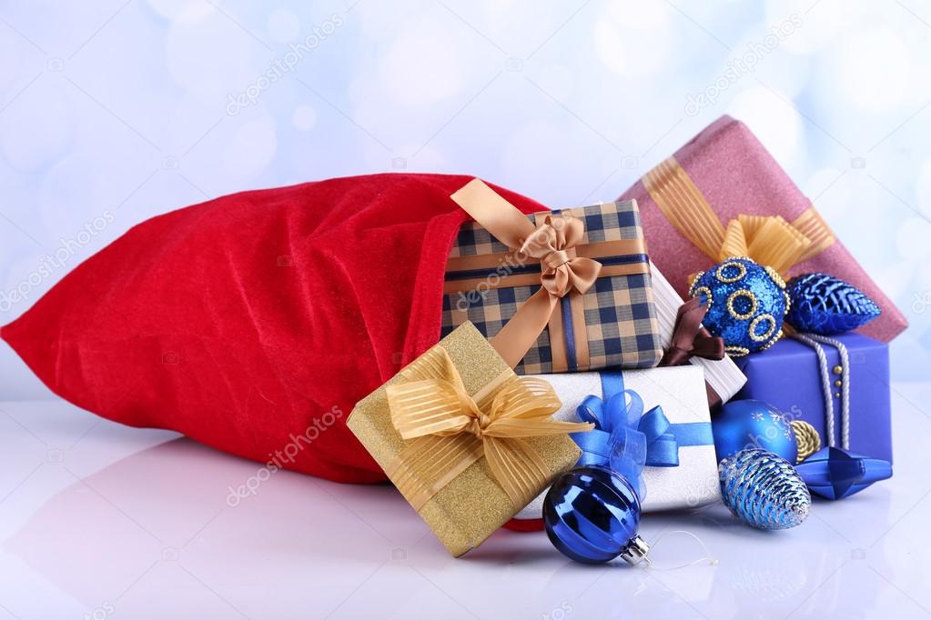 Red bag with Christmas toys and gifts