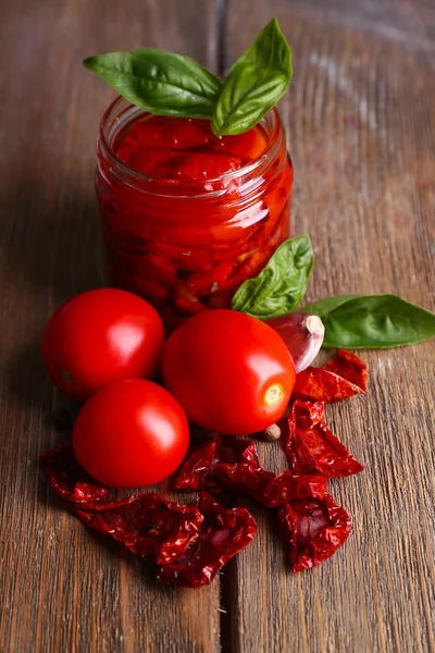 Sun dried tomatoes in glass jar — Stock Photo, Image