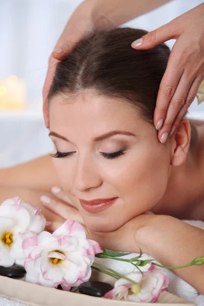 Beautiful young woman having massage in spa salon — Stock Photo, Image