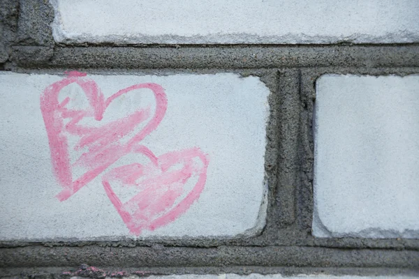 Hearts painted on bricks — Zdjęcie stockowe