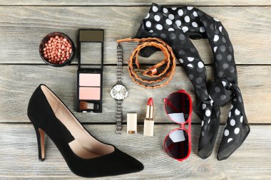 Essentials fashion woman objects on wooden background clipart