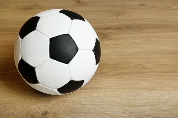 Soccer ball on wooden background — Stock Photo, Image