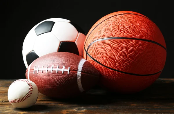 Sports balls on black background — Stock Photo, Image