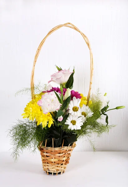 Flowers in basket on white background — Stock Photo, Image