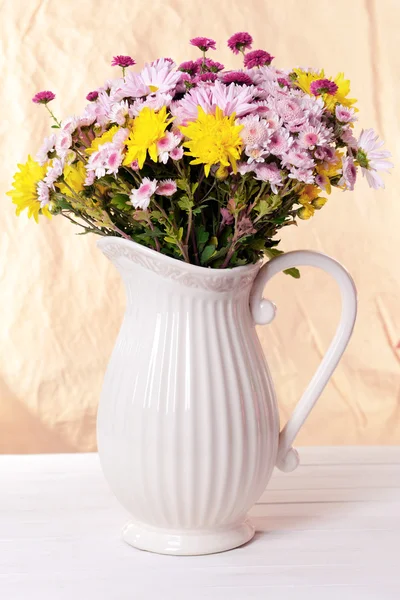 Beautiful flowers in pitcher — Stock Photo, Image