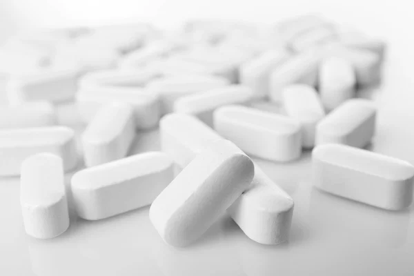 Pile of white pills — Stock Photo, Image