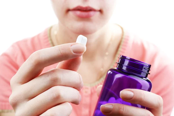 Pastilla en la mano de la mujer — Foto de Stock